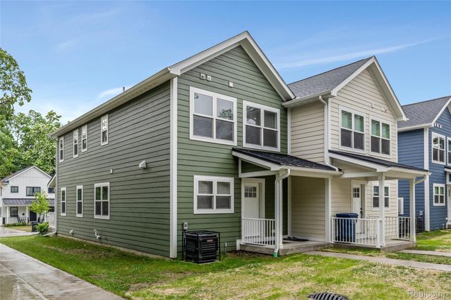 View from the parking pad showing back of the condo | Image 24