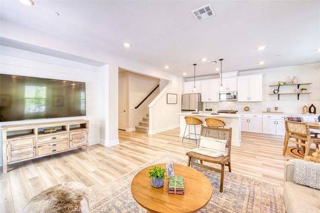 Open concept family room, gourmet kitchen and dining area. | Image 8