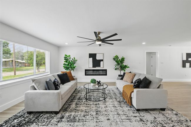 Living room featuring ceiling fan, light wood-style flooring, recessed lighting, and baseboards | Image 8