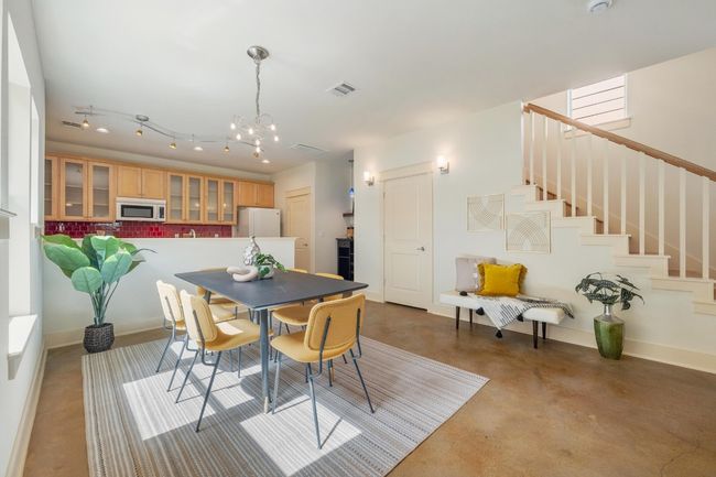 With its open layout and clear sightlines to the living room and kitchen, the dining area becomes the perfect setting for both intimate dinners and lively get- togethers | Image 10