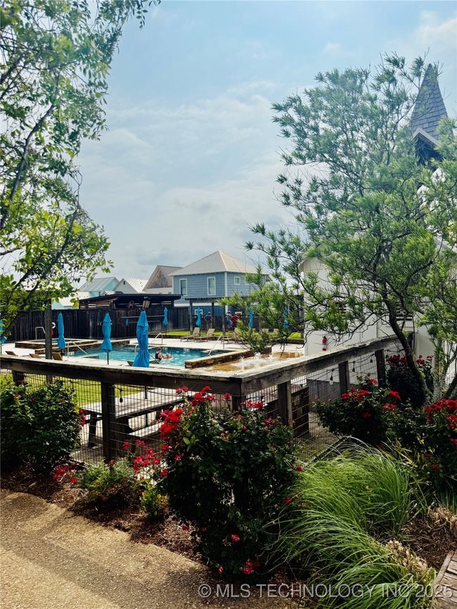 Pool, lounge chairs, hot tub and community grills | Image 52