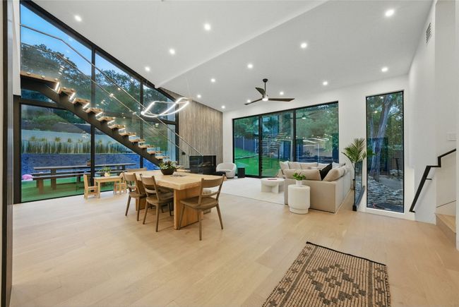 Dining area featuring stairs, wood finished floors, recessed lighting, and ceiling fan | Image 10