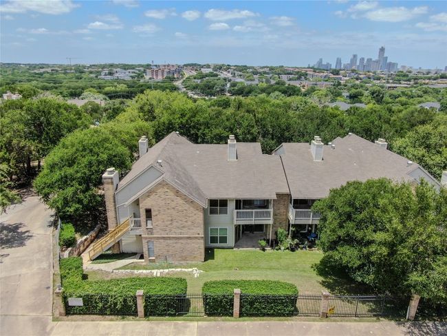Aerial view of property and surrounding area with a tree filled landscape | Image 5