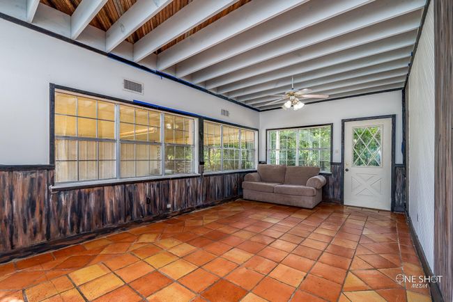 Unfurnished sunroom with ceiling fan and beam ceiling | Image 15