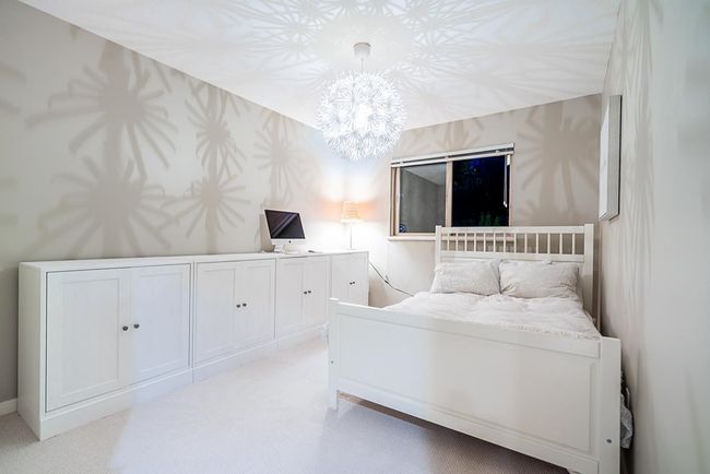Bedroom with a chandelier and light colored carpet | Image 25