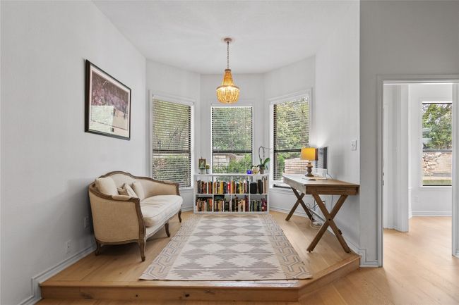 Living area with light wood-type flooring and baseboards | Image 24