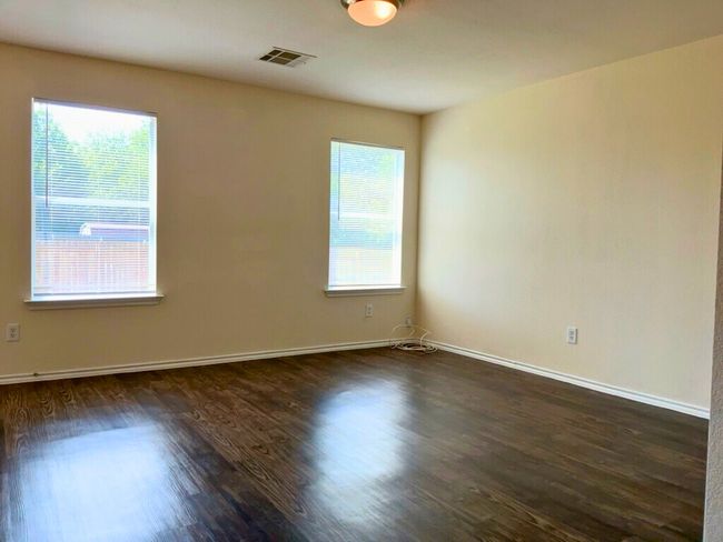 Living room with dark wood-style flooring | Image 10