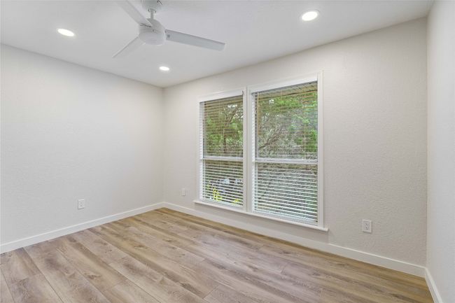 Unfurnished room with light wood-style floors, ceiling fan, recessed lighting, and baseboards | Image 27