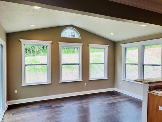 Light filled sunroom located right off the kitchen | Image 13