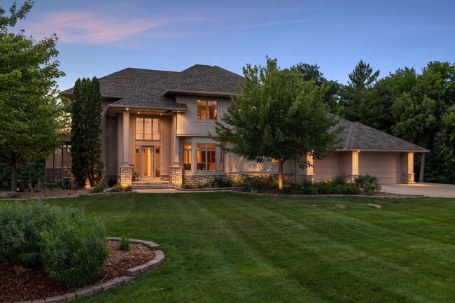 Twilight! Welcome to your private oasis on Lake O'Dowd, beautiful mature trees on lakeshore on a fabulous south metro recreational/fishing lake. Absolutely gorgeous curb appeal nestled on a fabulous, .87 acre lakeshore lot! | Image 4