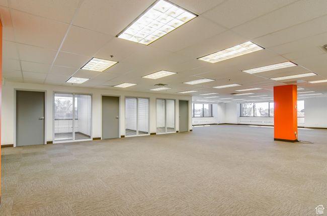 Unfurnished room featuring a drop ceiling and light carpet | Image 4