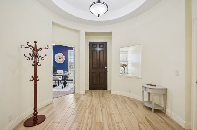 Foyer featuring a wealth of natural light, light wood finished floors, and baseboards | Image 5
