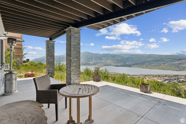 View of patio / terrace featuring a water and mountain view | Image 67