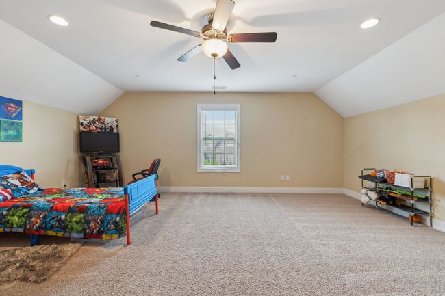 The carpeted bonus room features vaulted ceilings and recessed lighting, creating a bright and airy atmosphere. 1107 Sycamore Leaf Way Murfreesboro, TN 37129 | Image 29