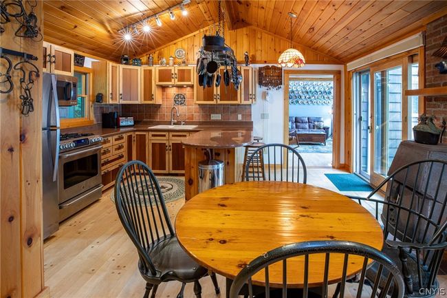 Eat-in kitchen and wood burning stove. | Image 26