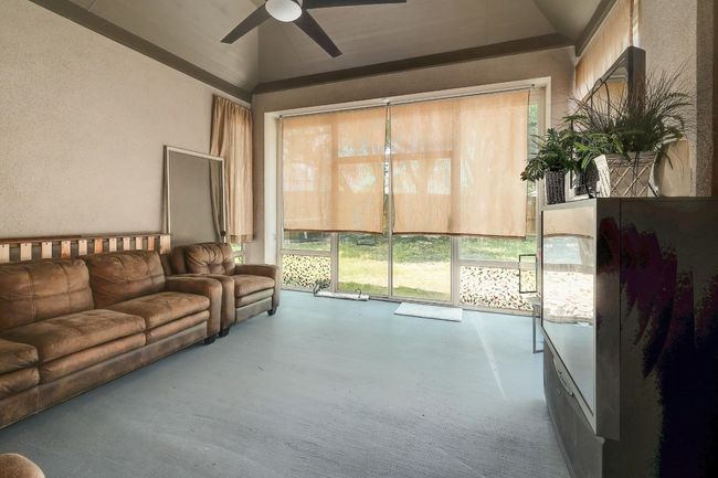 Sunroom / solarium featuring lofted ceiling | Image 33
