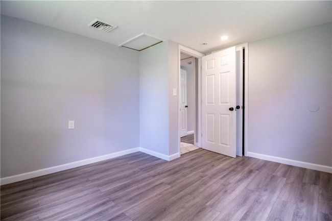 Unfurnished room with wood-type flooring | Image 13