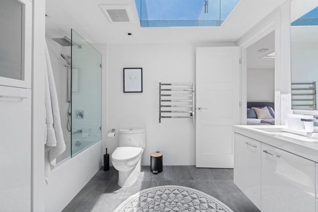Full bathroom featuring vanity and enclosed tub / shower combo | Image 7