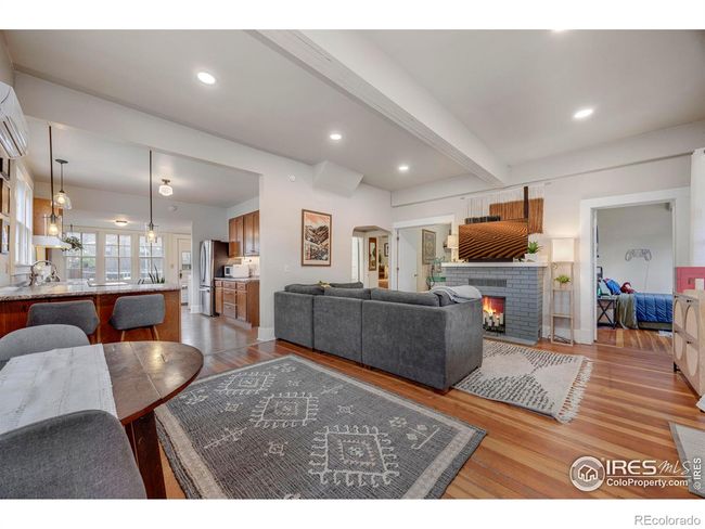 High ceilings, wood floors, fireplace. | Image 9