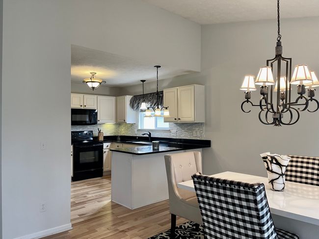 Modern Kitchen with Granite & New Hard wood floor. | Image 4