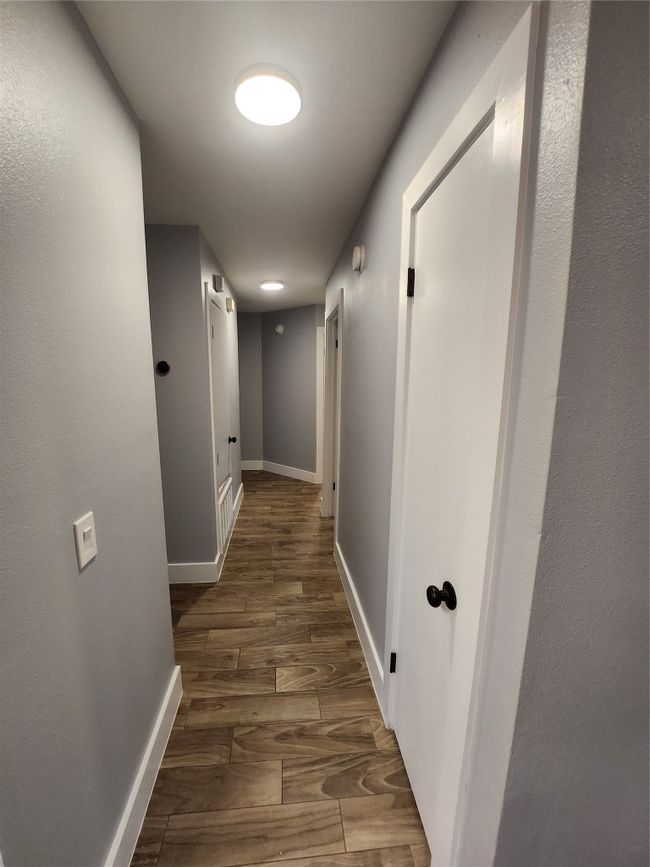 Hall with wood finished floors and baseboards | Image 13