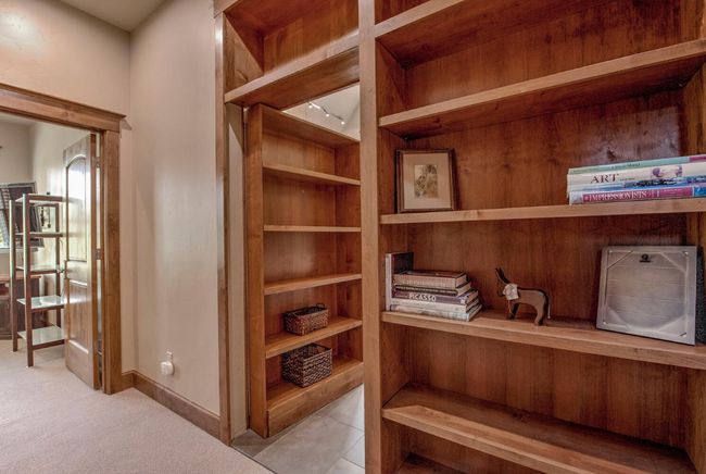 Enter through the bookshelf wall into the secret room - a Media/Family room! | Image 22