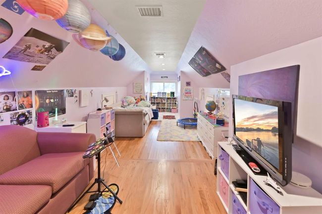 Discover the versatile bonus room over the garage, perfect as a bedroom, fitness area, or media room. | Image 37