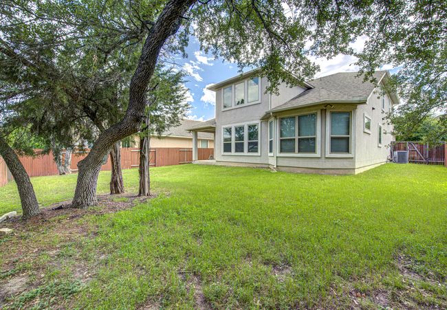 Back of property with a fenced backyard and roof with shingles | Image 29