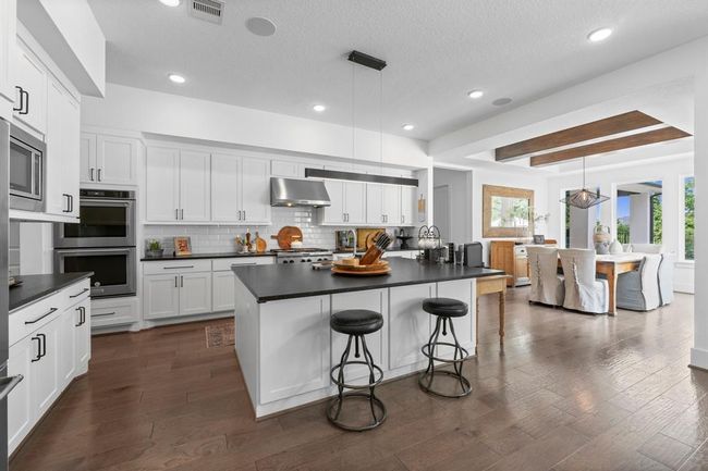 Kitchen and dining offer integrated design great for entertaining. | Image 19