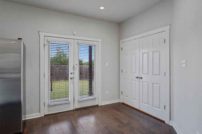 Entryway featuring french doors, dark wood finished floors, and recessed lighting | Image 15