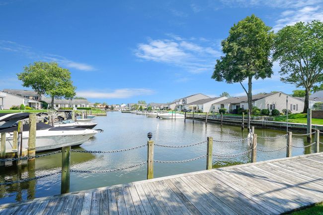 Dock with a residential view and a water view | Image 21