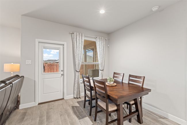Dining room with baseboards and light wood-style floors | Image 14