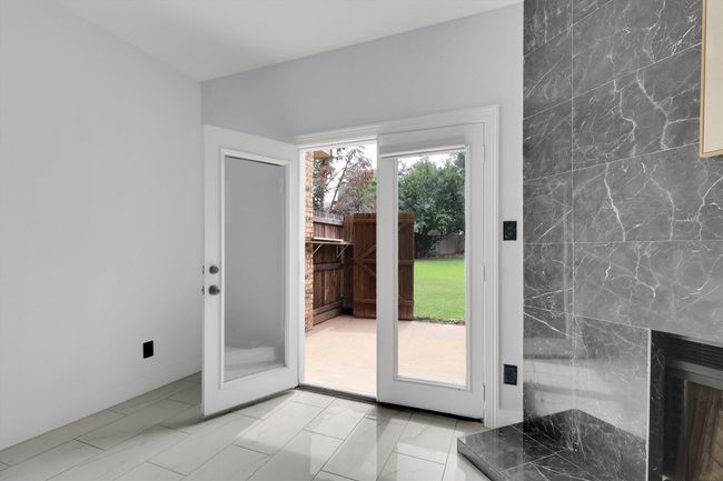 Doorway to outside featuring marble finish flooring | Image 9