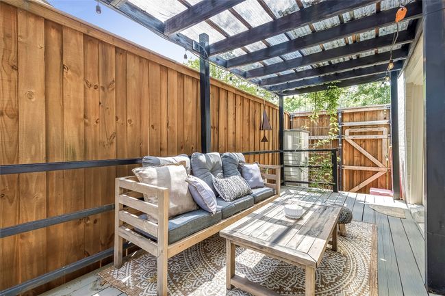 Wooden terrace with an outdoor hangout area | Image 38