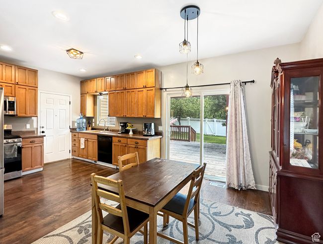 Dining area with sink and dark hardwood / wood-style flooring | Image 6