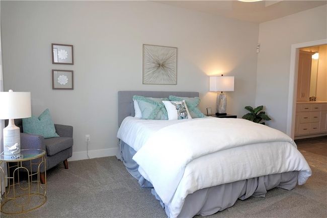 Bedroom with carpet floors and baseboards | Image 30