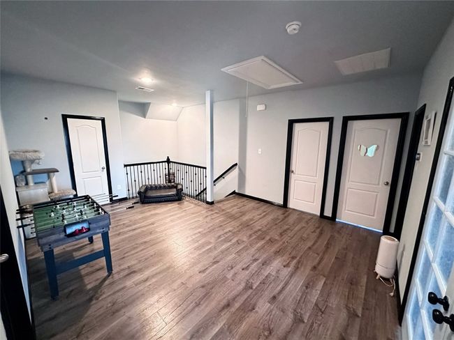 Upstairs landing area that can be a game room, second living, or other | Image 19