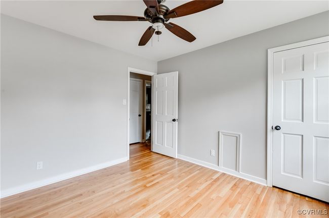 Unfurnished bedroom featuring light wood finished floors and a ceiling fan | Image 12