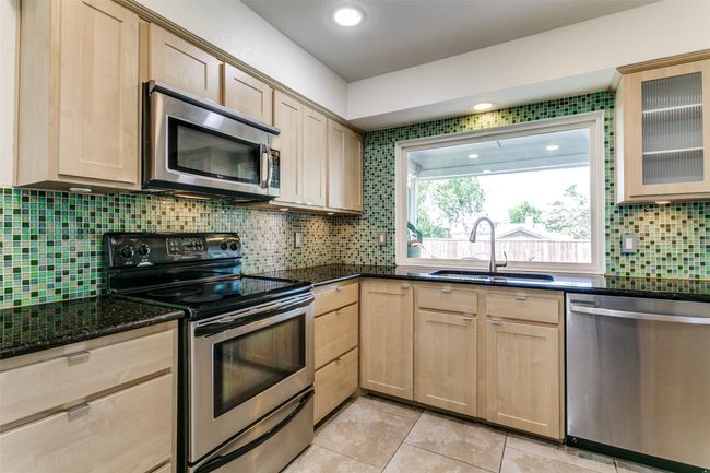 Great kitchen with large window to back porch. | Image 11