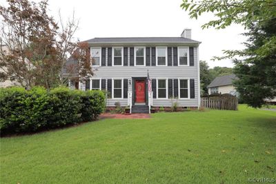 Colonial-style house featuring a front lawn | Image 2