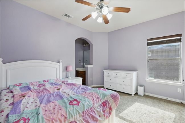 Unfurnished office with a raised ceiling, carpet flooring, and ceiling fan | Image 28