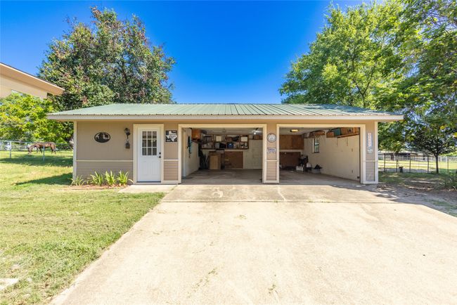 Garage featuring concrete driveway | Image 22