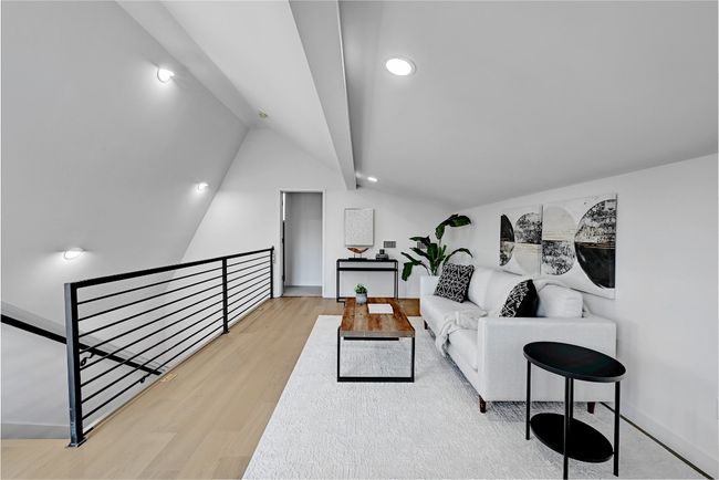 Living room with light wood-type flooring and vaulted ceiling | Image 18