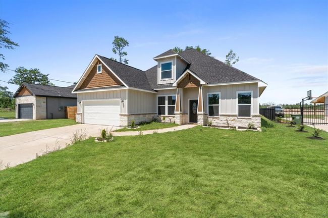 Beautiful new construction with modern curb appeal and extended driveway. | Image 4