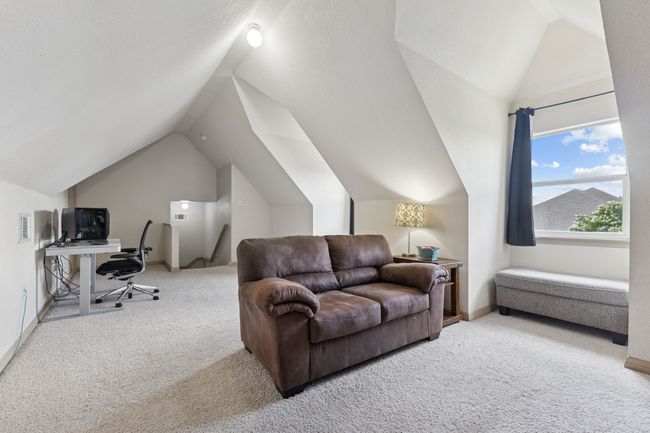 Office area featuring carpet floors, vaulted ceiling, and baseboards | Image 30
