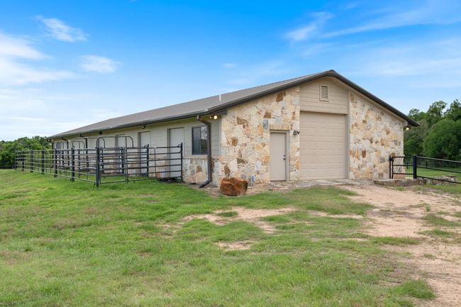 Exterior view of barn and stables. | Image 28