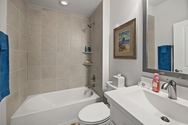 Bathroom with shower / tub combination, toilet, and vanity | Image 14
