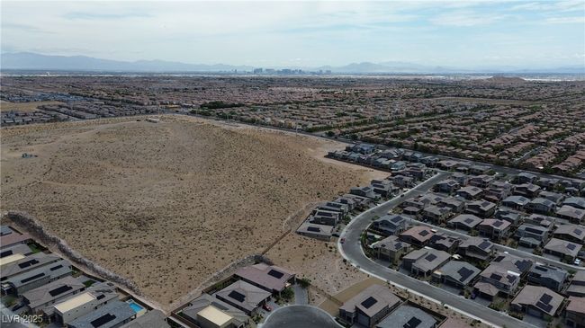Aerial view of property's location featuring a mountainous background and a desert landscape | Image 38