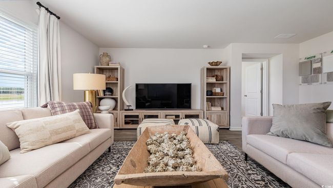 Living area with wood finished floors | Image 12