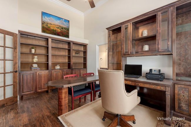 Office with crown molding, a ceiling fan, and dark wood-type flooring | Image 5